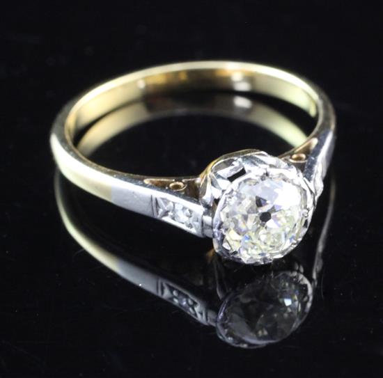 An early 20th century gold and solitaire diamond ring, size M.